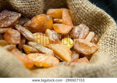 Close Up Of An Amber Stones In Linen Bag From Baltic Sea. Multic