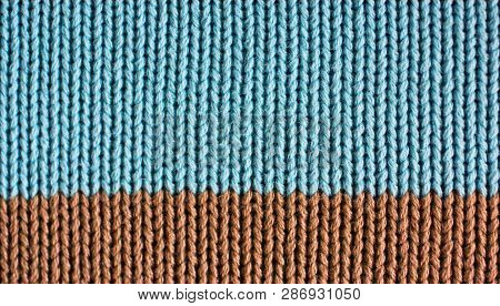 Texture Of Knitted Wool Fabric. Woolen Cloth. Striped Warm Knitting Sweater. Background For Wallpape