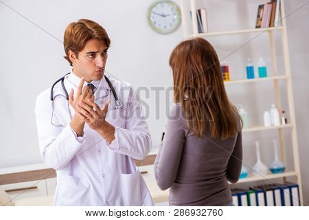 Deaf-mute female patient visiting young male doctor 