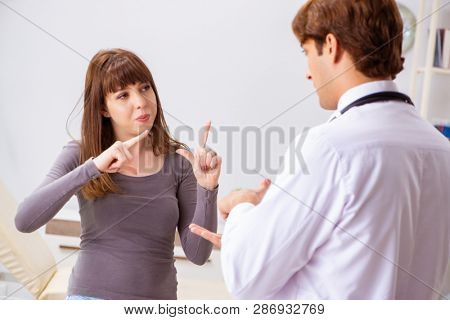 Deaf-mute female patient visiting young male doctor 