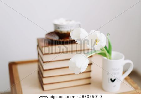 Freshl Tulips With Book And Cup Of Coffee On Wooden Background. Spring Flowers And A Cup Of Coffee W