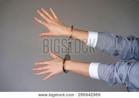 Arrested Woman Handcuffed Hands. Prisoner Or Arrested Terrorist, Close-up Of Hands In Handcuffs Isol