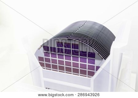 Silicon Wafers In White Plastic Holder Box On A Table- A Wafer Is A Thin Slice Of Semiconductor Mate