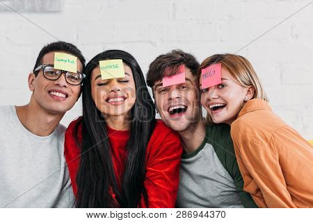 Multicultural Friends With Funny Nickname Labels On Foreheads