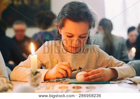Lviv, Ukraine - March 11, 2018. Little Girl Painting Easter Eggs. Ukrainian Easter Eggs Painting Wor