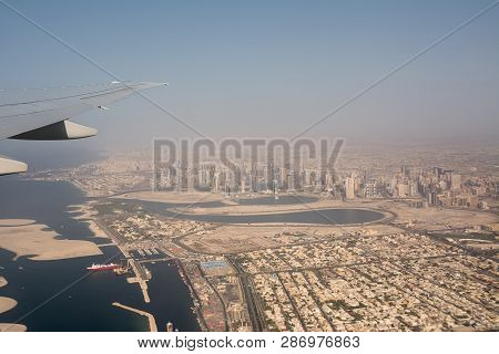 Dubai's Buildings And Harbor Seen From The Airplane Taking Off