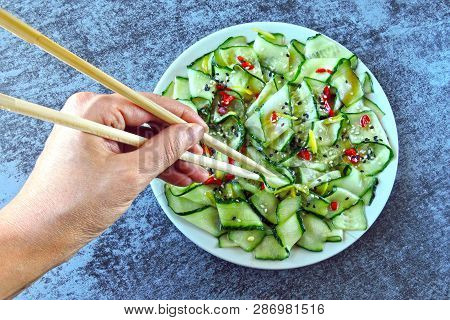 Cucumber Salad In Chinese Style. Salad With Cucumbers And Chili Pepper. Chinese Salad With Cucumber.