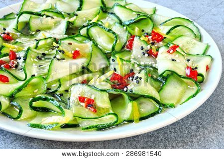 Cucumber Salad In Chinese Style. Salad With Cucumbers And Chili Pepper. Chinese Salad With Cucumber.