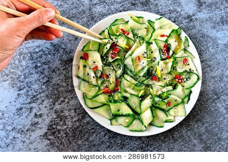 Cucumber Salad In Chinese Style. Salad With Cucumbers And Chili Pepper. Chinese Salad With Cucumber.