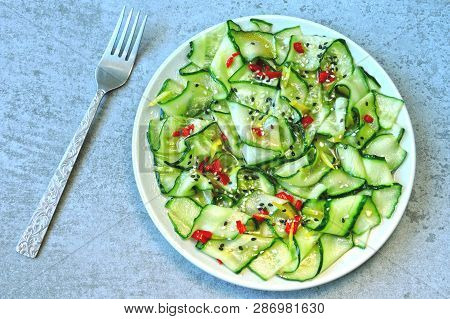 Cucumber Salad In Chinese Style. Salad With Cucumbers And Chili Pepper. Chinese Salad With Cucumber.