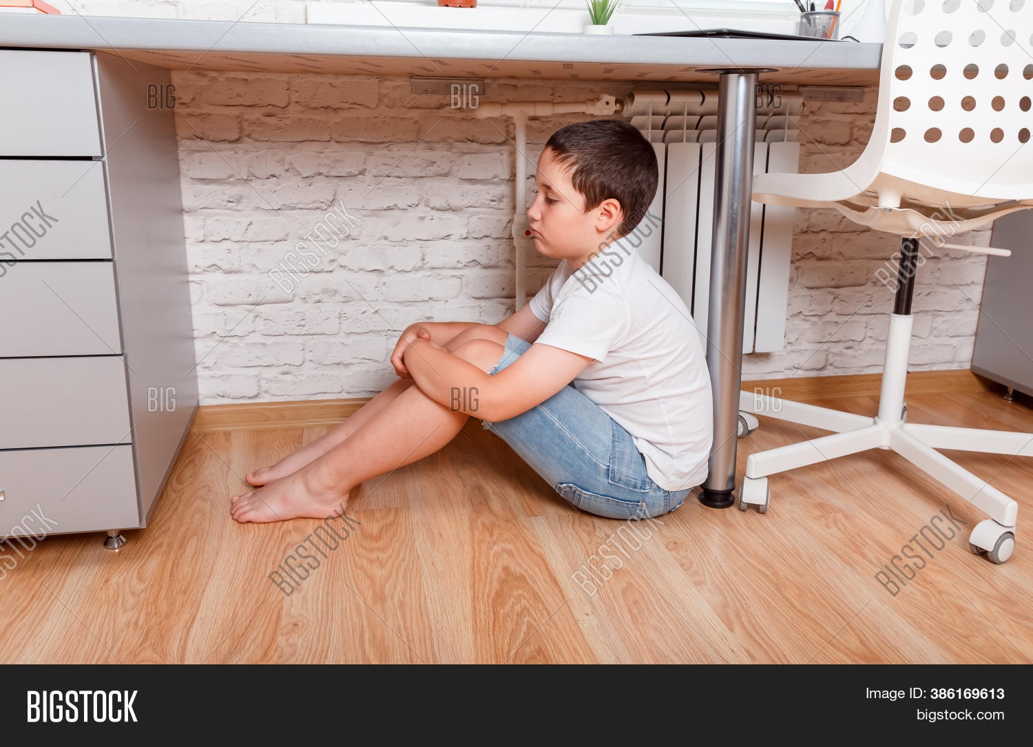 Teen under table Telegraph