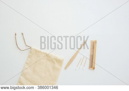 Eco Bag, Bamboo Toothbrush, Cotton Bud And Comb On White Bed Background. Environmental Protection, Z