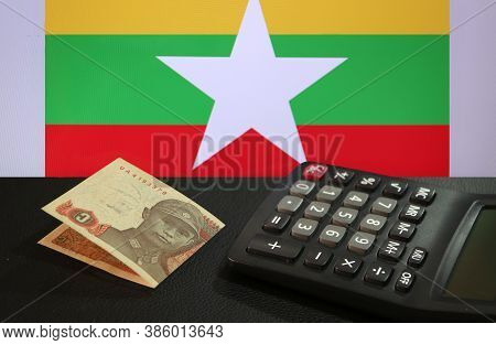 One Of Banknote Currency Myanmar Kyats With Calculator On The Black Floor With The Union Of Myanmar 