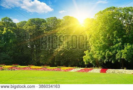 A Lovely Summer Garden With Extensive Lawns And Colorful Flower Beds. Wide Photo.