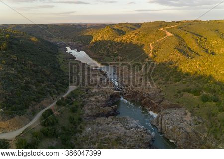 Pulo Do Lobo Waterfall Drone Aerial View With River Guadiana And Beautiful Green Valley Landscape At