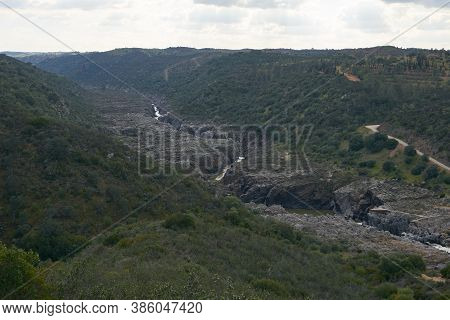 Pulo Do Lobo Waterfall Drone Aerial View With River Guadiana And Beautiful Green Valley Landscape At