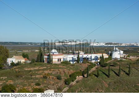 Windmill Of Castro Marim With Ayamonte And Guadiana River On The Foreground, In Portugal