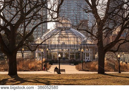 Early Spring Sunset In Toronto Allan Gardens Park With A Greenhouse In Front Of High Rise Buildings