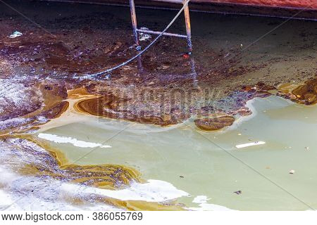 Ecological Catastrophy. Close-up. Spill Of Oil Products Into The Sea.