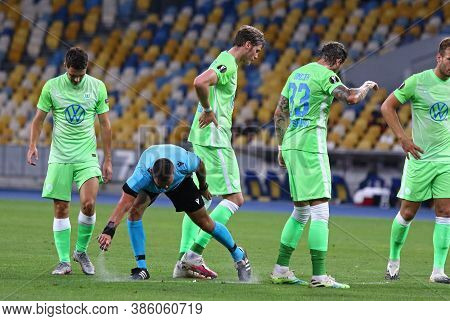 Kyiv, Ukraine - August 5, 2020: Referee Ivan Kruzliak (svk) Applying Vanishing Spray Before A Free K