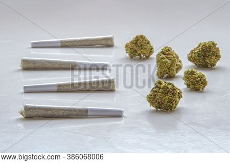 Pre-rolls Cannabis Joints And Dried Flower Marijuana On A Clear Background