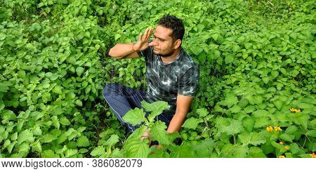 District Katni, India - September 02, 2019: An Indian Village Boy Doing Yogasana At Green Leaf Fores