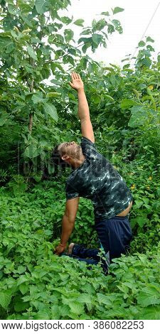 District Katni, India - September 02, 2019: An Indian Village Poor Boy Doing Yogasana At Green Leaf 