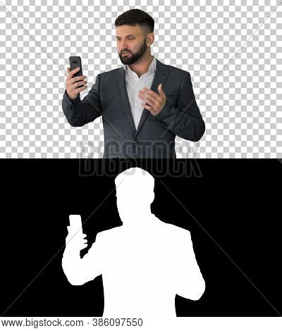 Businessman Making A Video Call With His Smartphone, Alpha Chann