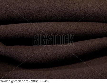 Blanket Made Of Fluffy Fleece Fabric. Background Made Of Soft Plush Fleece Material With Lots Of Rai