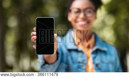 African Female Student Showing Smartphone Blank Screen Recommending Application Standing In Park Out