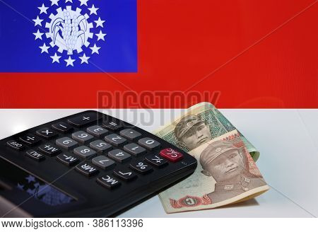 Two Piece Of One Kyat, Myanmar Banknote Currency With Calculator On The White Floor With The Obsolet