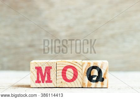 Alphabet Letter Block In Word Moq (abbreviation Of Minimum Order Quantity) On Wood Background