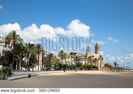 Empty Promenade Passeig De La Ribera With The Views Of Church Sant Bartomeu Y Santa Tecla, Sitges, C