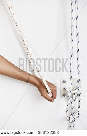 Closeup Hands Holding The Rope, Iyengar Yoga At Studio, White Wall