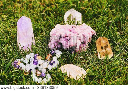 Collection Of Natural Mineral Crystals On Green Grass, Esoteric Healing Lifesytle Concept
