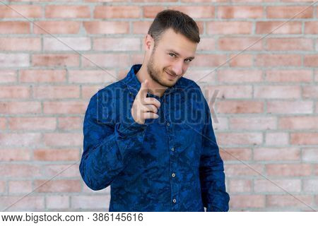 Cool British Man With Beard Outdoor In Front Of Brickstone Wall In England