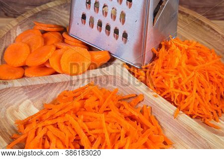 Carrots Grated Finely And Coarsely, Sliced Into Circles By Means Of The Stainless Steel Kitchen Grat