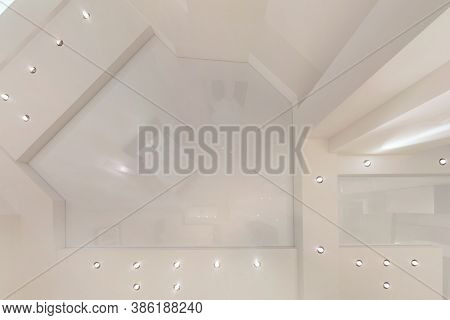 Suspended Ceiling With Halogen Spots Lamps And Drywall Construction In Empty Room In Apartment Or Ho