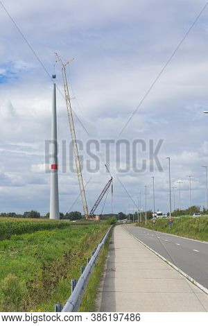 Sint Gillis Waas, Belgium, 24 August 2020, Large Crane Next To A Wind Turbine Under Construction