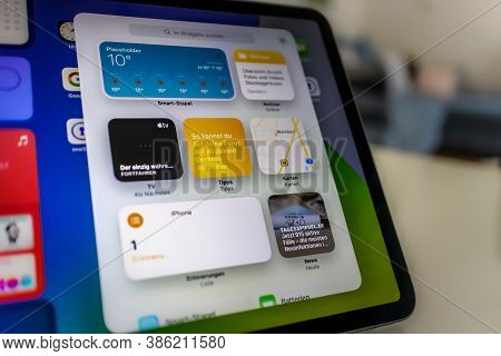 Frankfurt, Germany - September 17th 2020: A german photographer installing the all new ipadOS 14 sof