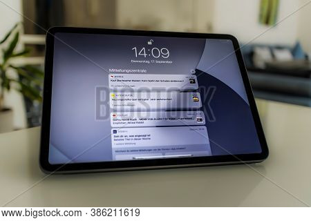 Frankfurt, Germany - September 17th 2020: A German Photographer Installing The All New Ipados 14 Sof