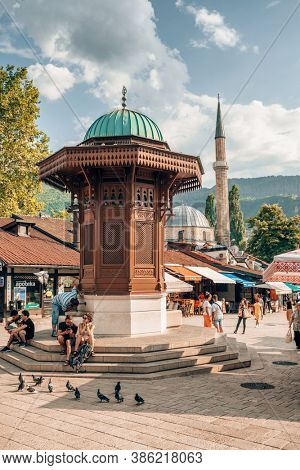 Sarajevo, BiH - August 28, 2019: Bascarsija square with Sebilj wooden fountain in Old Town Sarajevo in Bosnia and Herzegovina