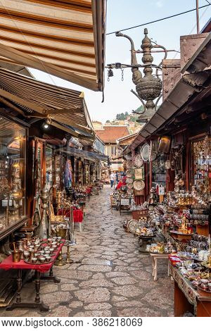 Sarajevo, BiH - August 28, 2019: Tradigional girf shops in historical center of Sarajevo, Bascarsija. Shopping bosnian souvenirs in Sarajevo old town