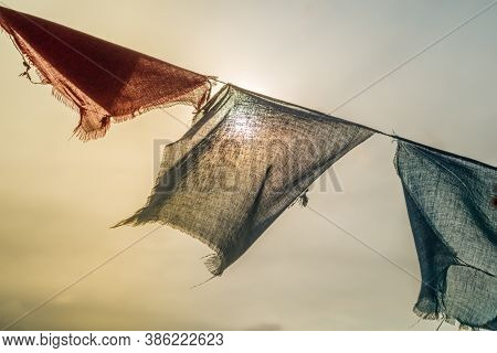 Colorful Prayer Flags With Sun Shining Through One Of Prayer Flags