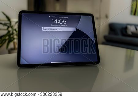 Frankfurt, Germany - September 17th 2020: A German Photographer Installing The All New Ipados 14 Sof