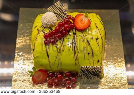 Culinary Art Green Cake With Berry Decor