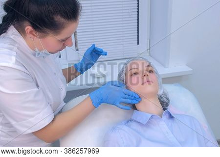 Cosmetologist Applying Moisturising Healing Cream After Injections Biorevitalization On Woman Face S