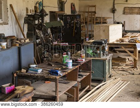Barskon, Kyrgyzstan - July 10, 2019: Table With Tools, Wood  And  Machines In A Yurt (ger) Factory A