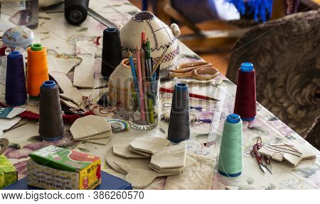Barskon, Kyrgyzstan - July 10, 2019: Table With Tools, Spools Of Thread And  Felt In A Yurt (ger) Fa