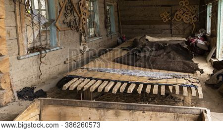 Barskon, Kyrgyzstan - July 10, 2019:  Wood Construction And Felt In A Yurt (ger) Factory And Worksho
